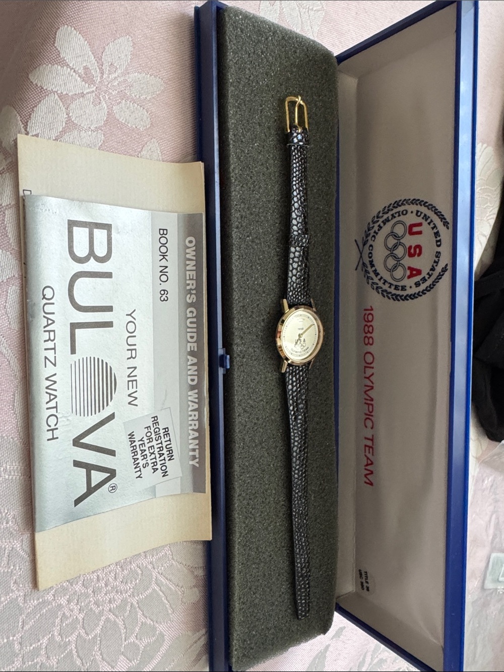1988 Olympic Team Bulova Women's Black Strap Watch with Gold face